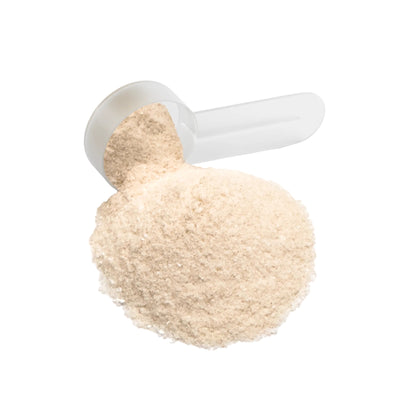 Close-up of white measuring scoop with IKOLLIN Hydration Powder Lemonade electrolyte powder spilling out, white background

