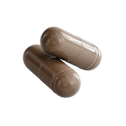 Close-up of two IKOLLIN Resveratrol brown veggie capsules, 600mg trans-resveratrol, white background